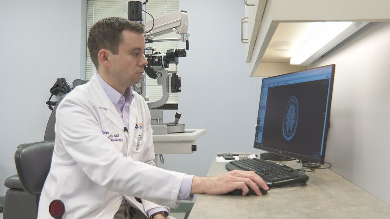 Dr. Brinkley examines patients skull .jpg